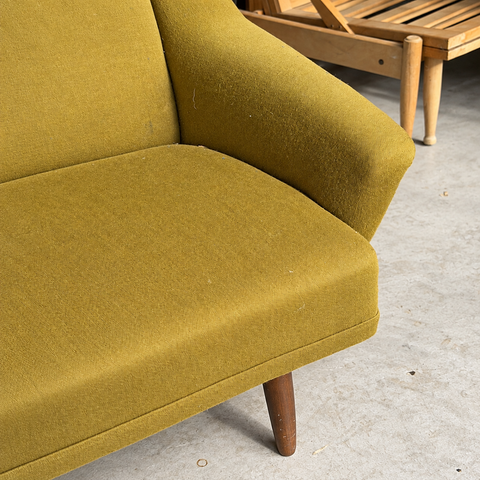 Vintage Danish curved upholstered sofa — upholstery and condition detail