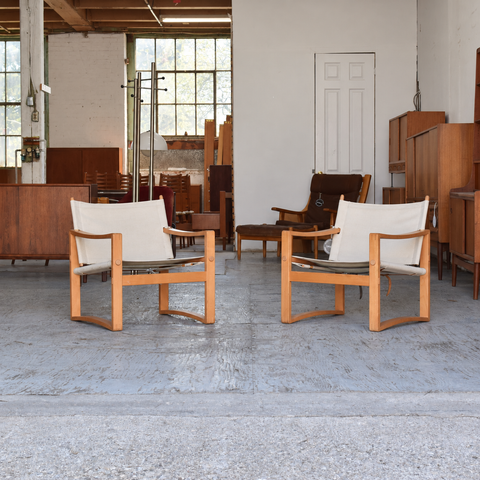 Børge Jensen white canvas lounge chairs — pair
