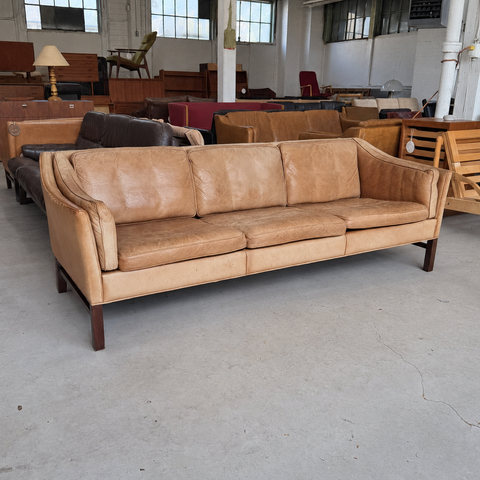 Frederik A. Kayser tan leather sofa — showroom view 2