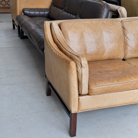 Frederik A. Kayser tan leather sofa — showroom view 3