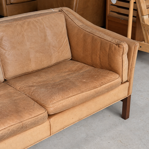 Frederik A. Kayser tan leather sofa — showroom view 4