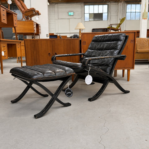 Black Leather Chair and Ottoman — full three-quarter view