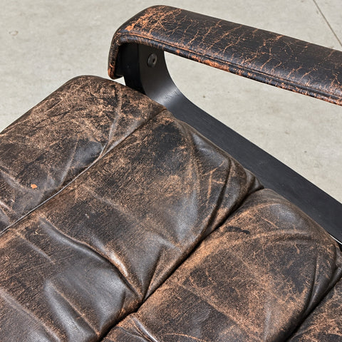 Black Leather Chair and Ottoman — detail view