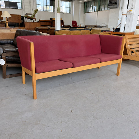 Red Upholstered Sofa — full three-quarter view