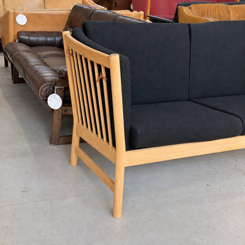 Black Upholstered Oak Sofa — detail view