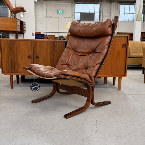 Tan high-back Siesta chair — full three-quarter view